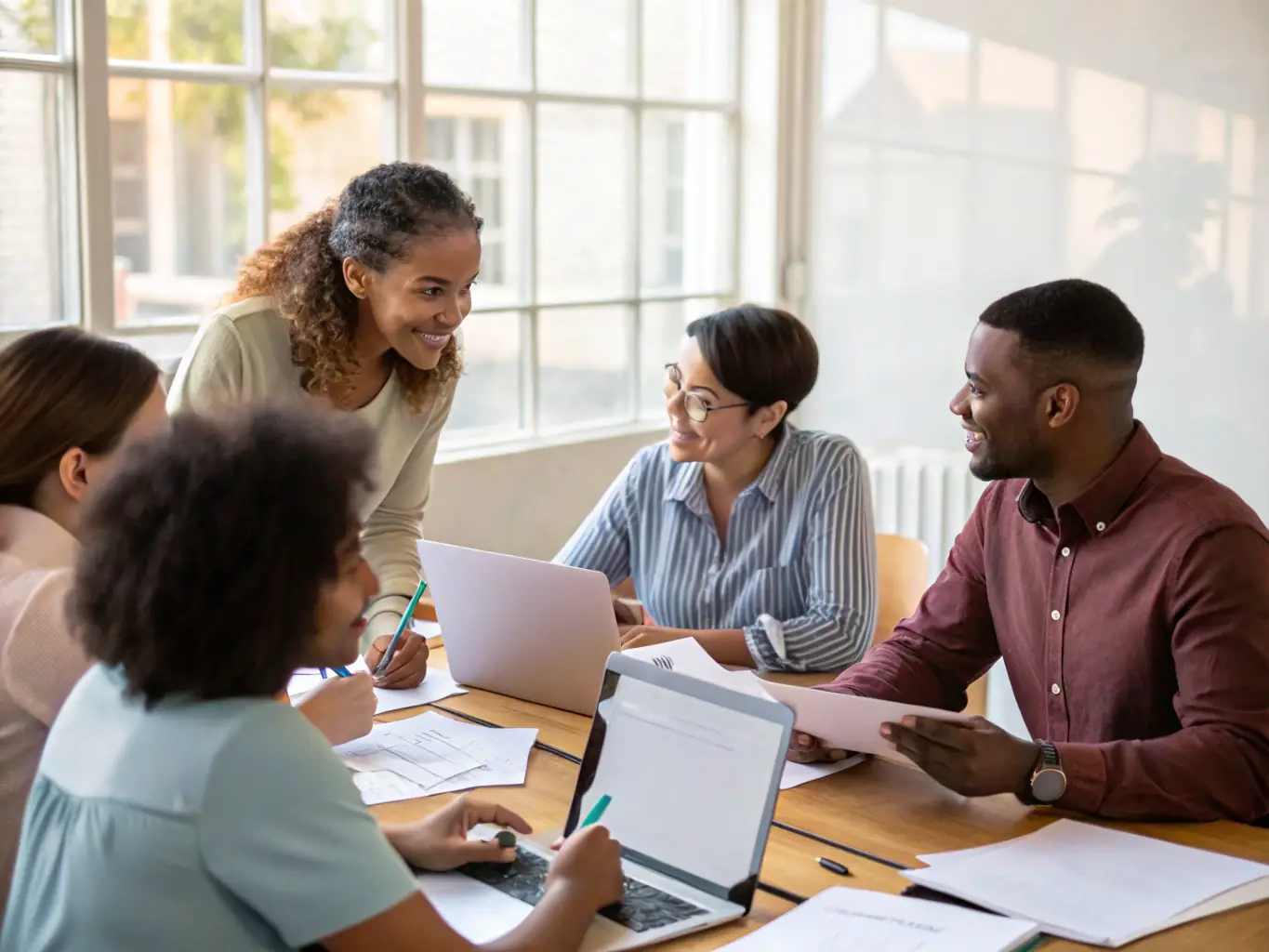 A diverse group of employees attending a presentation on Employee Provident Fund (EPF) benefits, highlighting the importance of employer-sponsored retirement plans.